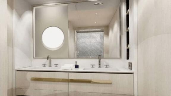 Bright bathroom with double sinks and stylish mirror, perfect for luxurious onboard living.