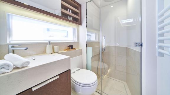 Bright and elegant bathroom with shower and stylish decor on Lagoon Seventy 7.