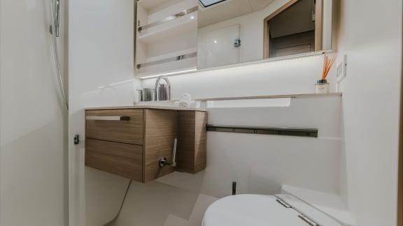 A sleek and modern bathroom design combining functionality and elegance in a compact space.