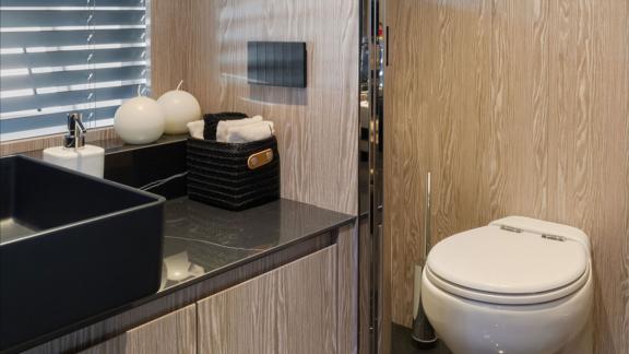 Elegant wooden textures and black details offer both comfort and luxury onboard.