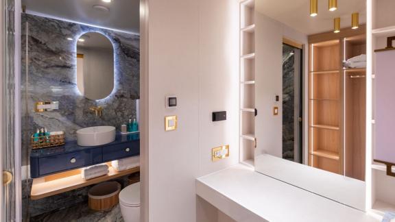 Scorpios Motorsailer features a marble-finished bathroom, wide vanity unit and illuminated mirror.