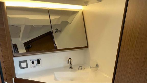 The bathroom of yacht Clio features modern design and lighting, ready for a crewless charter.