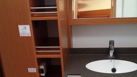 The bathroom on the Diagoras yacht features a sink with a spacious countertop and a mirrored cabinet.