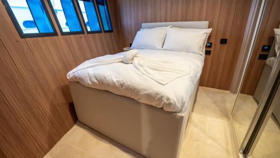 The stylish bedroom of Almila motor yacht in Marmaris features modern design and a comfortable bed.