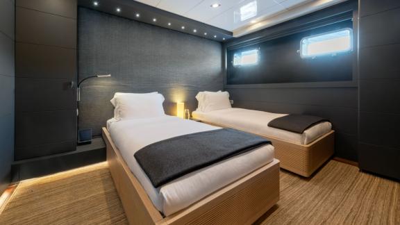 Relax in the comfortable twin cabin of your yacht.