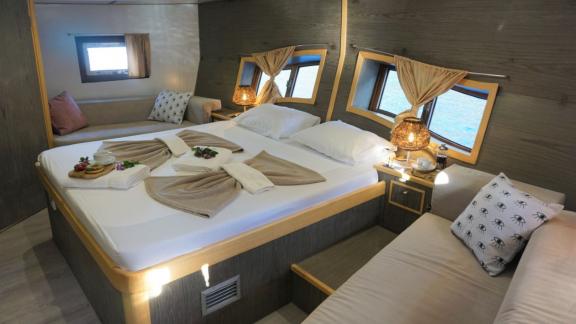 Elegantly furnished cabin with double bed on Gulet Aria, perfect for restful nights at sea.