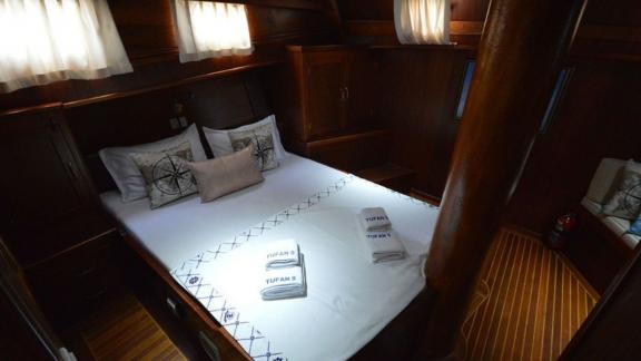 Comfortable double cabin on Gulet Tufan 5 with fresh linens and nautical decor.