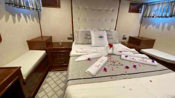 Comfortable and elegantly decorated cabin on the Queen Almila gulet, ready for your relaxation.