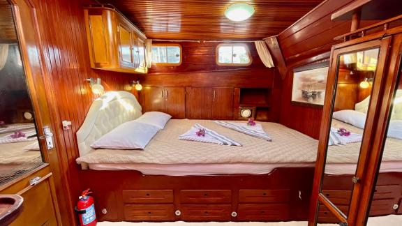 Enjoy a restful sleep in the master cabin of Gulet Daphne S, equipped with all amenities.