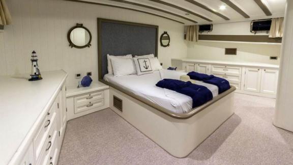 Luxurious cabin on The Blue Sea sailing yacht with stylish double bed.