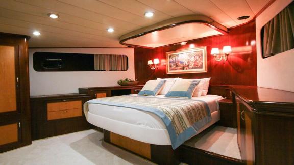 Elegant and spacious master cabin with king-size bed on a yacht in Bodrum.