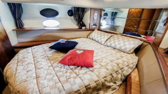 The master bedroom of motor yacht Ela provides comfortable and spacious sleeping accommodations.