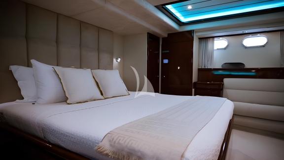 The cabin of the Hasard yacht features modern decor and a spacious double bed.