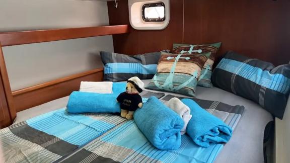 The cabin on the catamaran Cecilia offers comfort with charming details and a cozy bed.