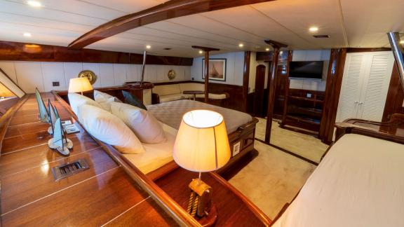 Stylishly furnished main cabin of a motor sailer with 5 cabins in Fethiye, with luxurious wooden furniture and cosy ambi