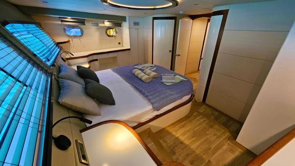 Spacious master cabin on Gulet Arni with modern design and comfortable bed.