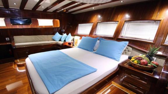 The cabin of the gulet Dear Lila offers a cosy double bed and stylish furnishings.