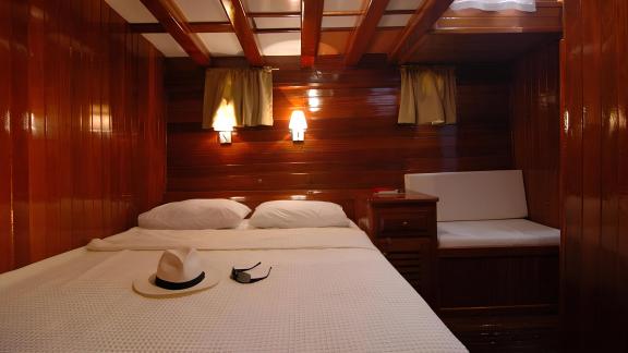 Stylish cabin on the Sunworld 8 with a cozy double bed and soft lighting.