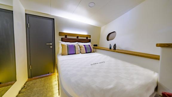 Stylish cabin with comfortable double bed on Gulet Golden Glory.