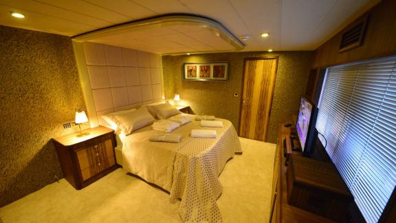 The bedroom of Simay F yacht offers comfort with modern decor and a large bed.