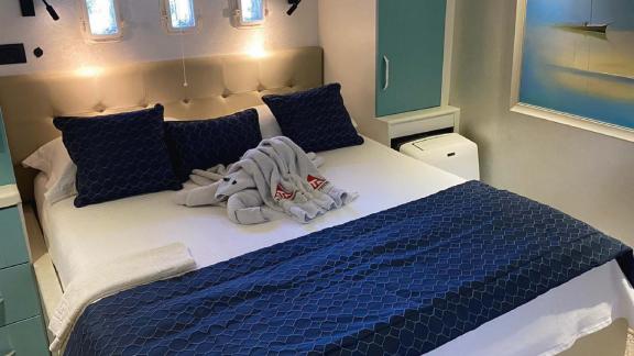 Cosy cabin on board the gulet Mrs Elcih in Göcek, Turkey, with a comfortable double bed.