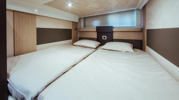 The cabin with twin beds on motor yacht Brown Sugar offers comfortable accommodation.