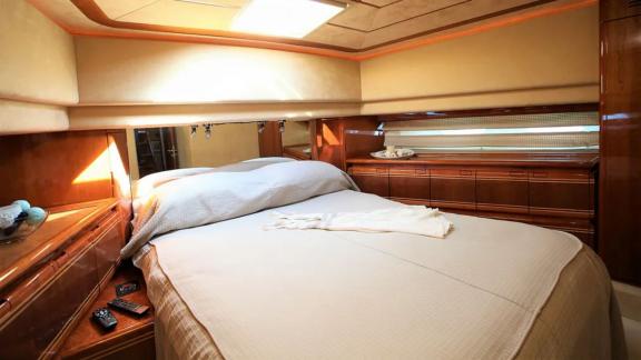 Double bedroom on the yacht Kentavros 2 with a comfortable double bed and stylish decoration.