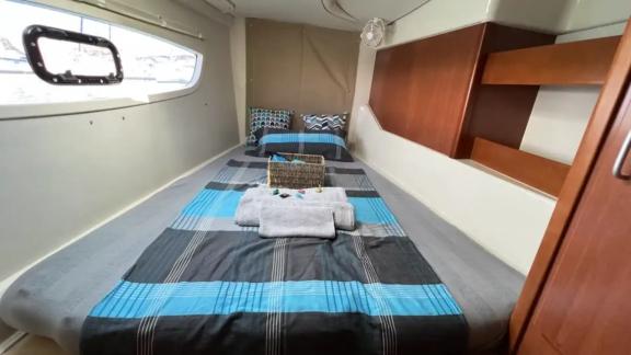 The cabin on the catamaran Cecilia offers comfort with a spacious bed and cozy atmosphere.