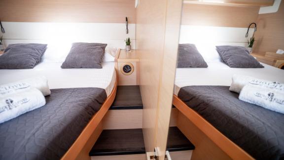 Stylish double cabin on Catamaran Lucky Clover featuring modern amenities and a cozy ambiance.