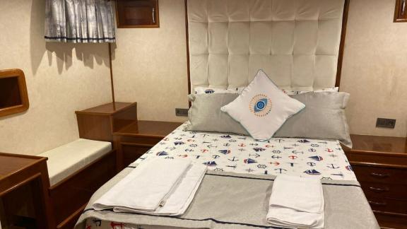 Nautically themed cabin on the Queen Almila gulet, perfect for a restful night.