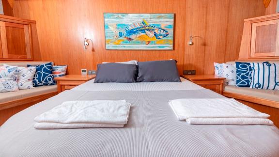 Double bed in the guest cabin of the luxurious Gulet Bodrum Queen in Bodrum, Turkey.