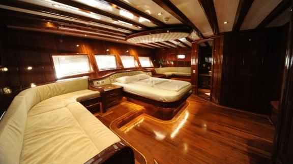 The spacious cabin of the gulet Dear Lila offers luxurious seating.