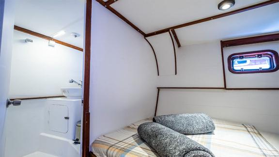 Cozy guest cabin of the 22 meter Gulet Castiel with ensuite bathroom and comfortable double bed.