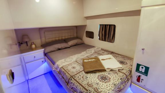 The comfortable bedroom of motor yacht Zeus 1 offers luxurious and cozy accommodation.