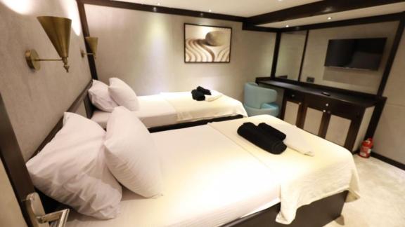 Modern twin bedroom on the trawler Nayk 3 with stylish design.