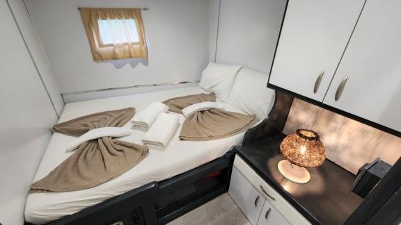 Small yet comfortable cabin with double bed and stylish details on Gulet Aria.