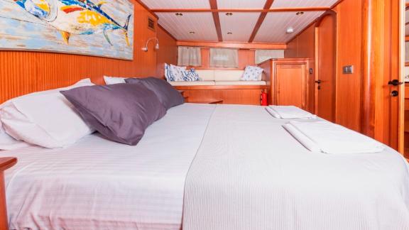 Spacious guest cabin of the luxurious Gulet Bodrum Queen in Bodrum, Turkey, with a double bed.