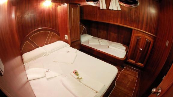 Comfortable cabin with double bed and extra sleeping area on Gulet Galip Nur