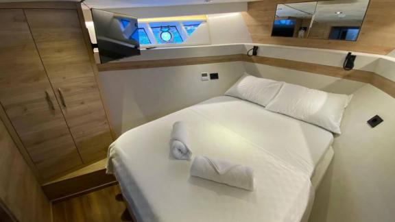 Double guest cabin of motor yacht Serpil D features a comfortable bed and modern amenities.