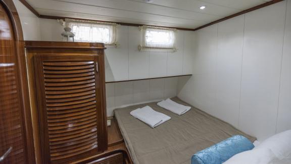 The double cabin of Gulet Faralya has simple decor and small windows.