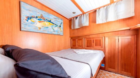 Guest cabin of the luxurious Gulet Bodrum Queen in Bodrum, Turkey, with a cozy double bed.