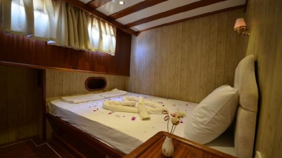 Inviting cabin with a cozy double bed on Gulet Miss Vela in Marmaris. Ideal for restful nights.