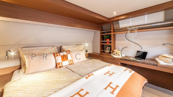 Master cabin with stylish Hermès design, desk, and modern amenities aboard a Princess S Yacht