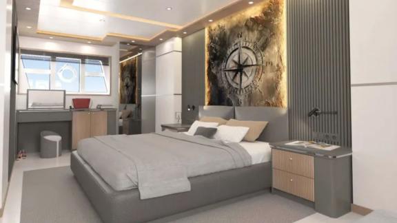 The master cabin of trawler Lavin features a modern bedroom with a large bed, elegant wall decor, and a work area.