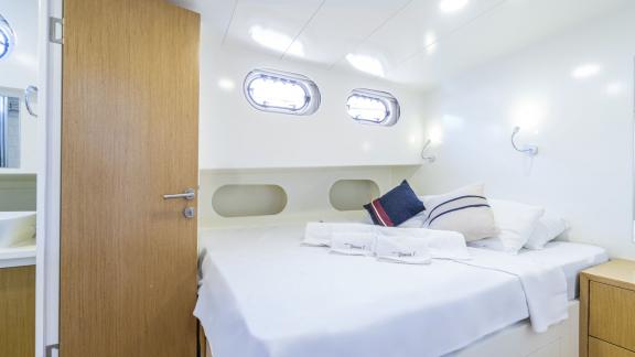 Compact double cabin with windows and ensuite bathroom for maximum comfort.