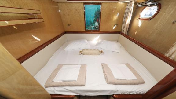 The double bedroom on motor yacht Custom Blanka offers a luxurious and comfortable resting area.