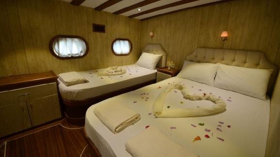 Comfortable double cabin with stylish beds on Gulet Miss Vela in Marmaris. Ideal for families or couples.