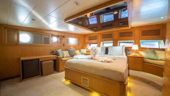 A spacious and luxurious cabin on a traditional Turkish gulet.