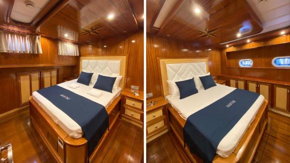 Cozy double cabin with luxurious double bed and wooden decor on Gulet K. Salih Ünlü.