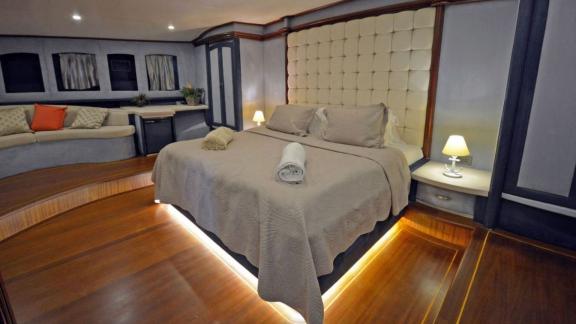 Gulet Bella Mare in Bodrum, with a comfortable bed, elegant wooden floors and stylish furnishings.